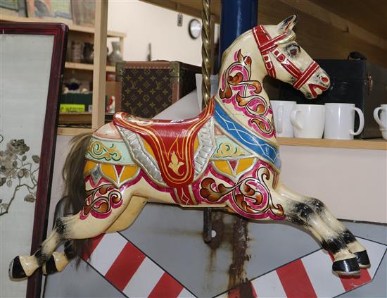An Edwardian polychrome painted carved wood carousel horse